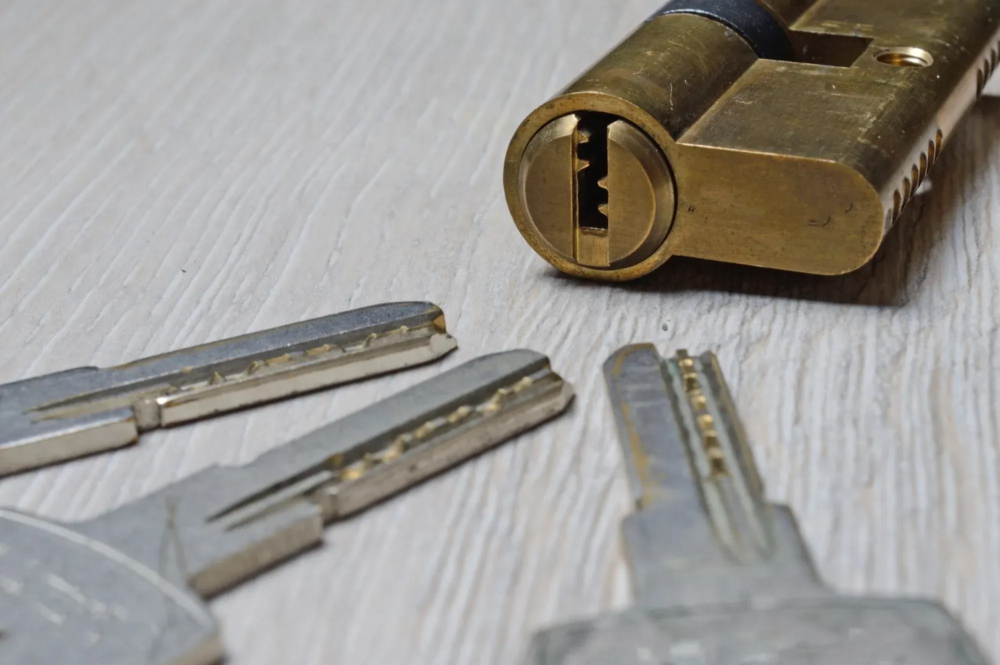 Lock cylinder and keys on a workbench