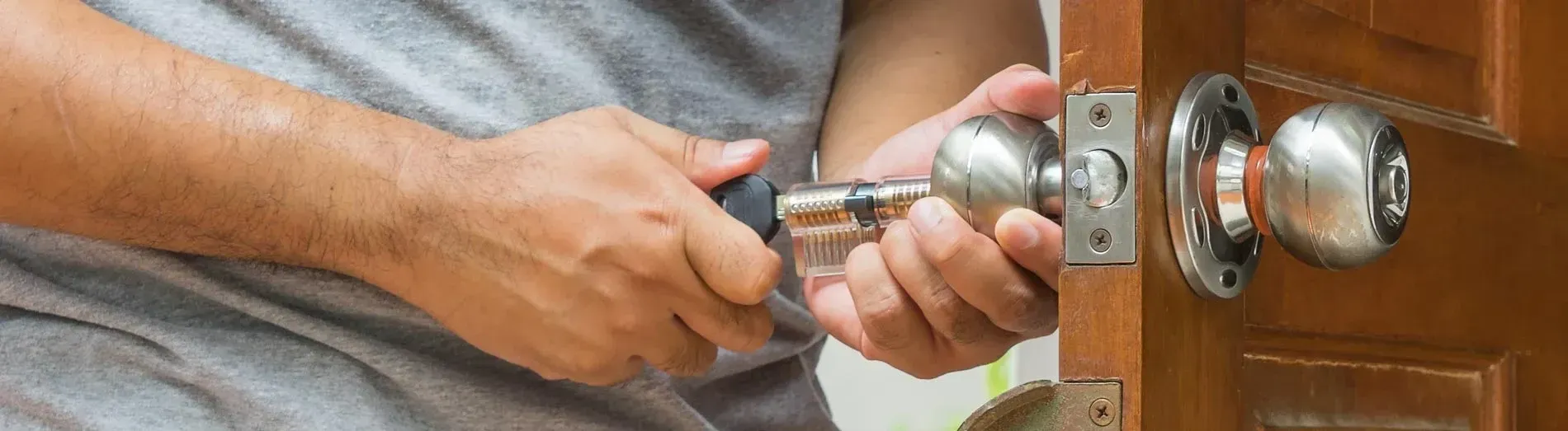 Locksmith working on a door lock