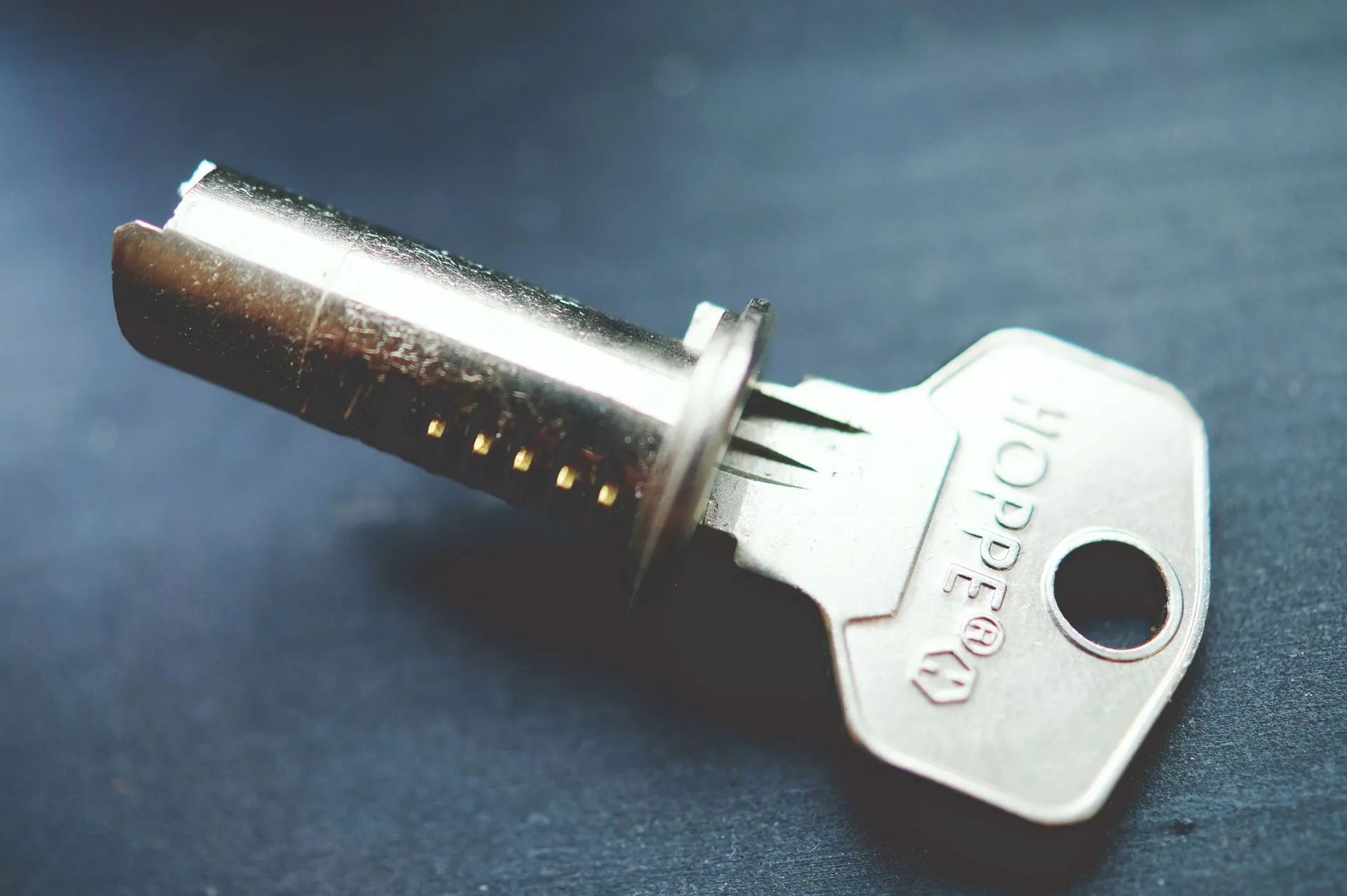 Close-up of a key and cylinder lock