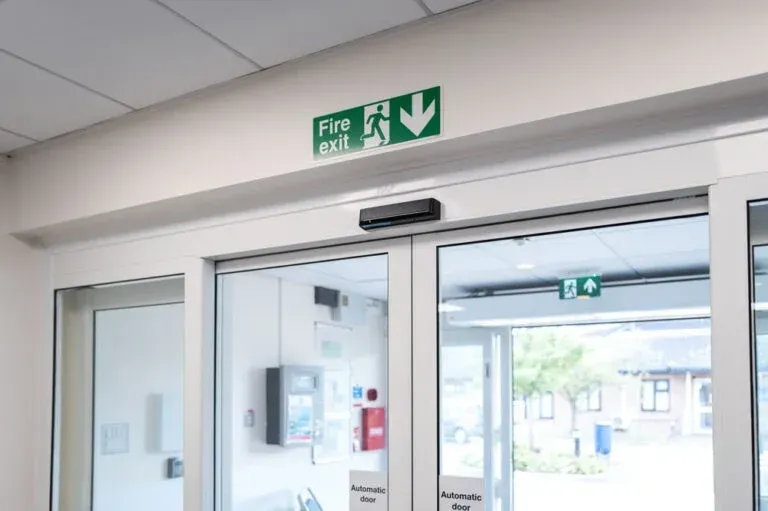 Sliding glass door with a door closer mechanism